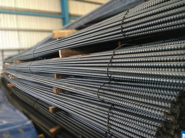 Stack of TMT steel bars ready for construction.